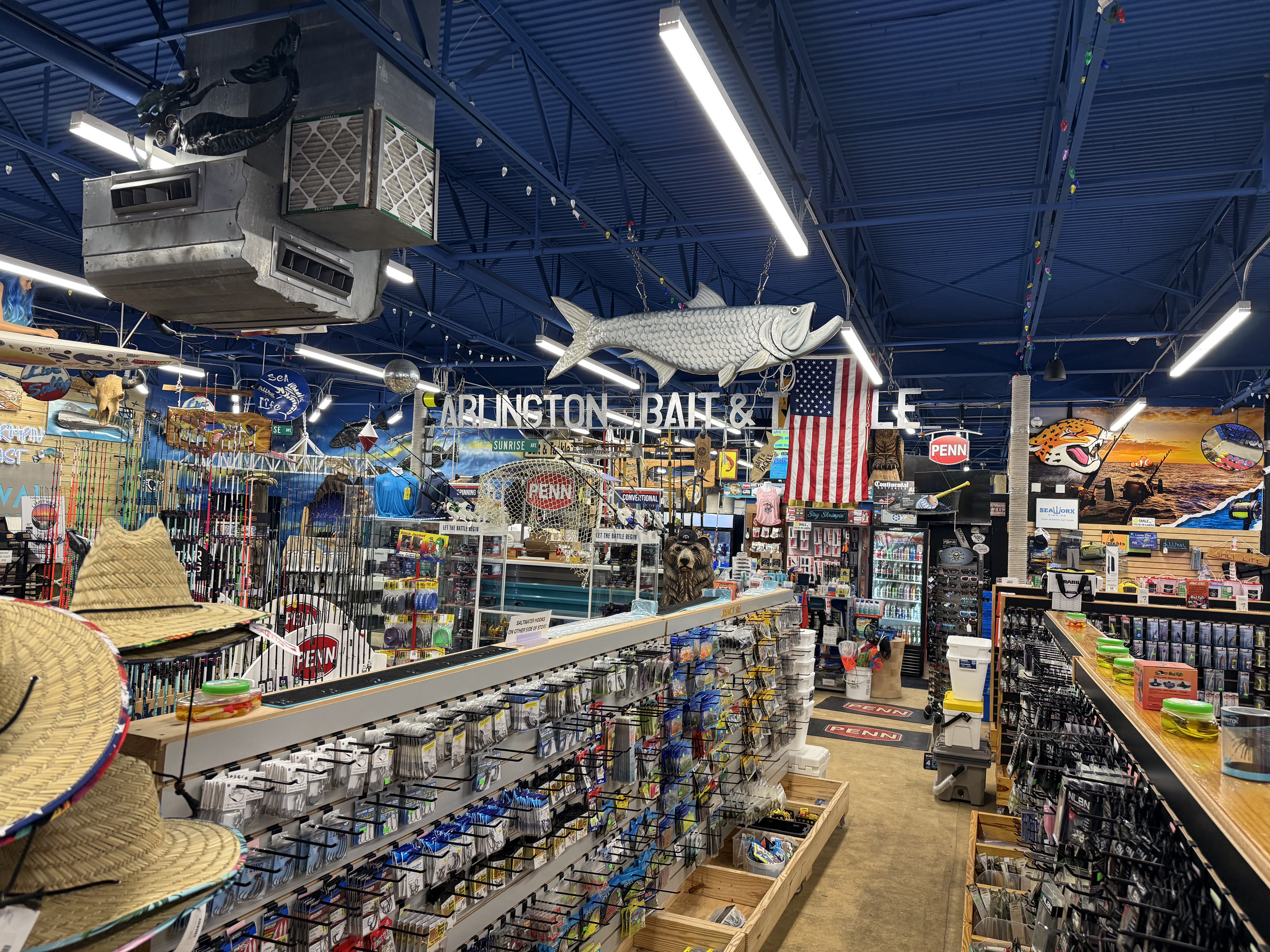 Wide aisle view inside Arlington Bait & Tackle