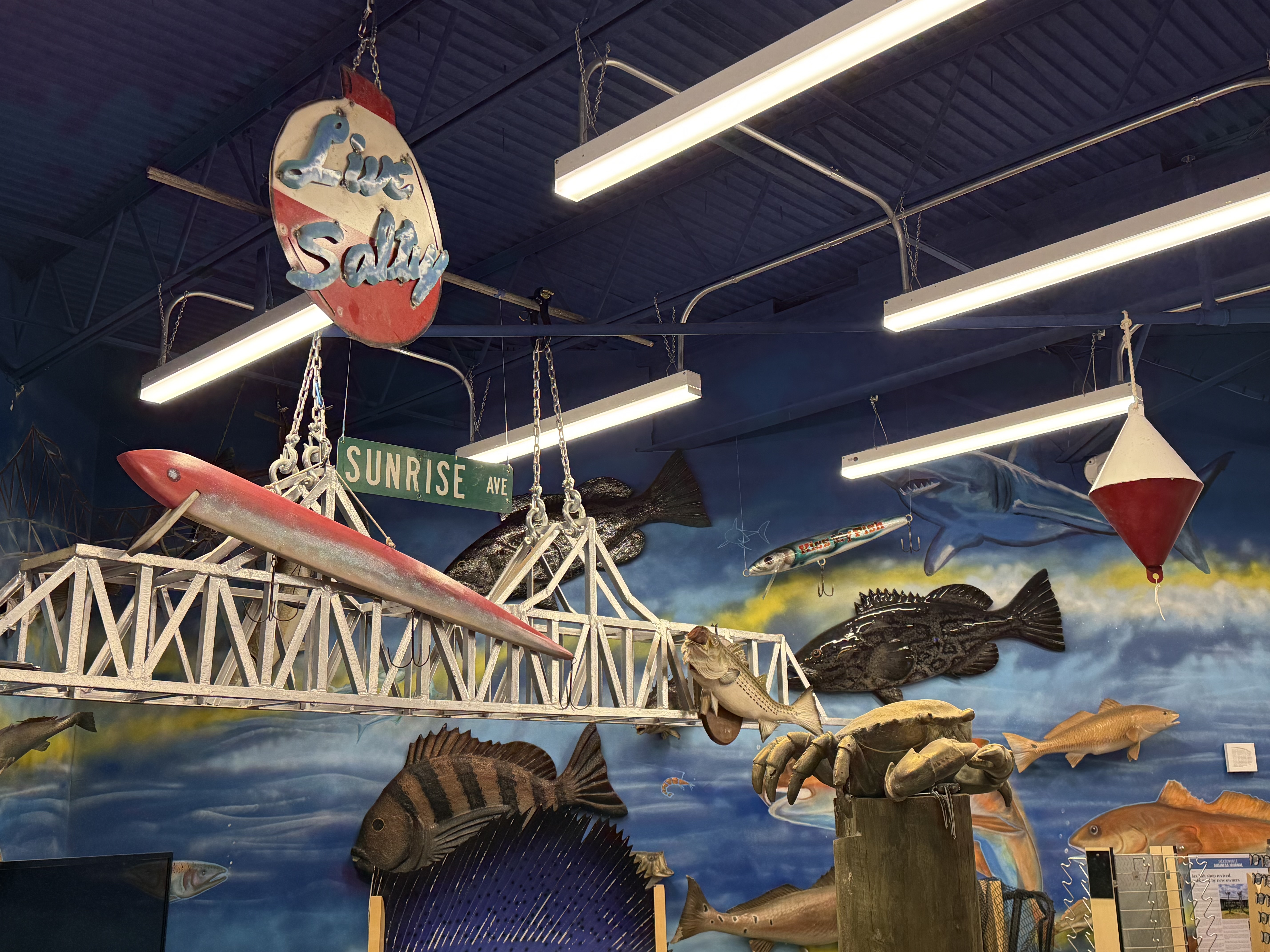 Fishing displays and wall mural inside the shop